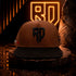 Gorra dominicana GCAPS Mi Tierra marrón y negro con bordado RD 3D – foto 1